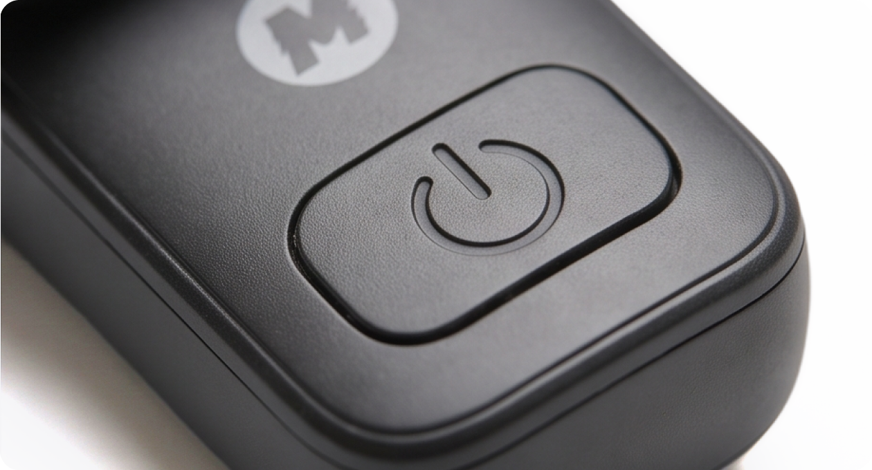 The power button and logo on the back of the Mini Mic Pro