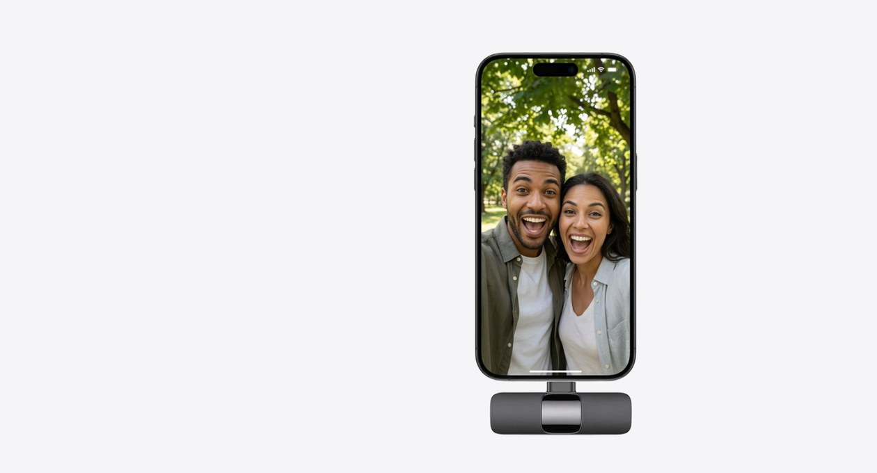 A phone with the receiver attached, recording two smiling people